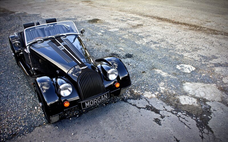 Black Morgan Roadster on gravel