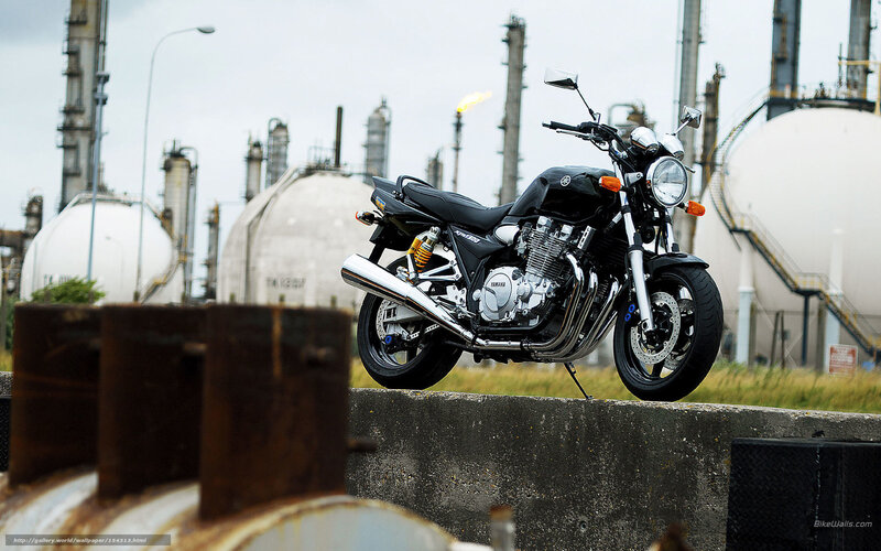 Black motorcycle at industrial site