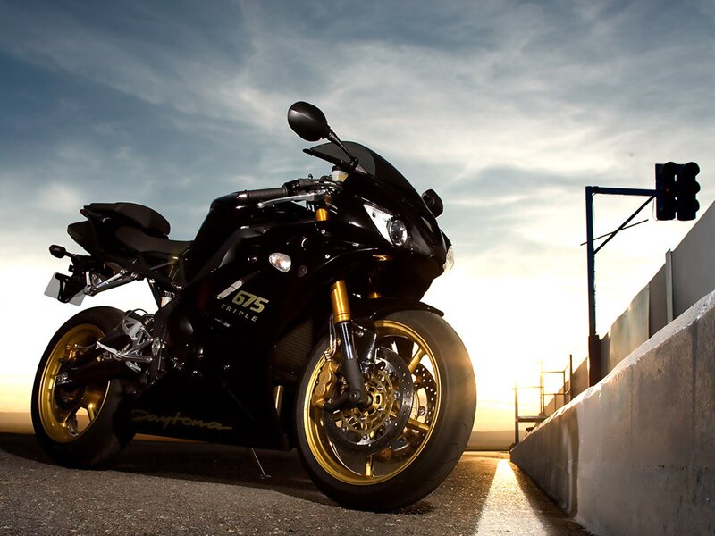 Black motorcycle at sunset