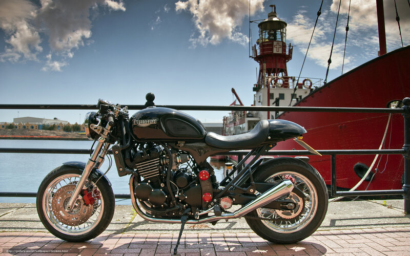 Black motorcycle by the harbor
