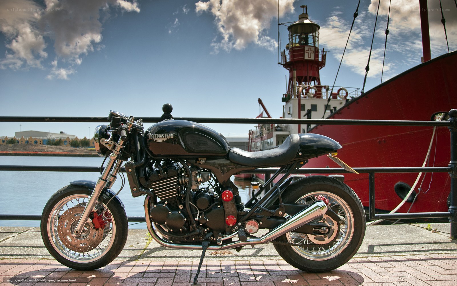 Black motorcycle by the harbor