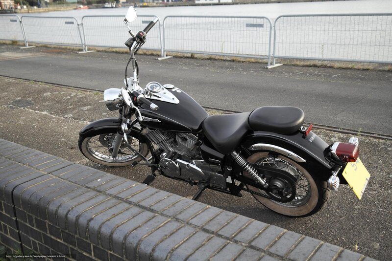 Black motorcycle by the water