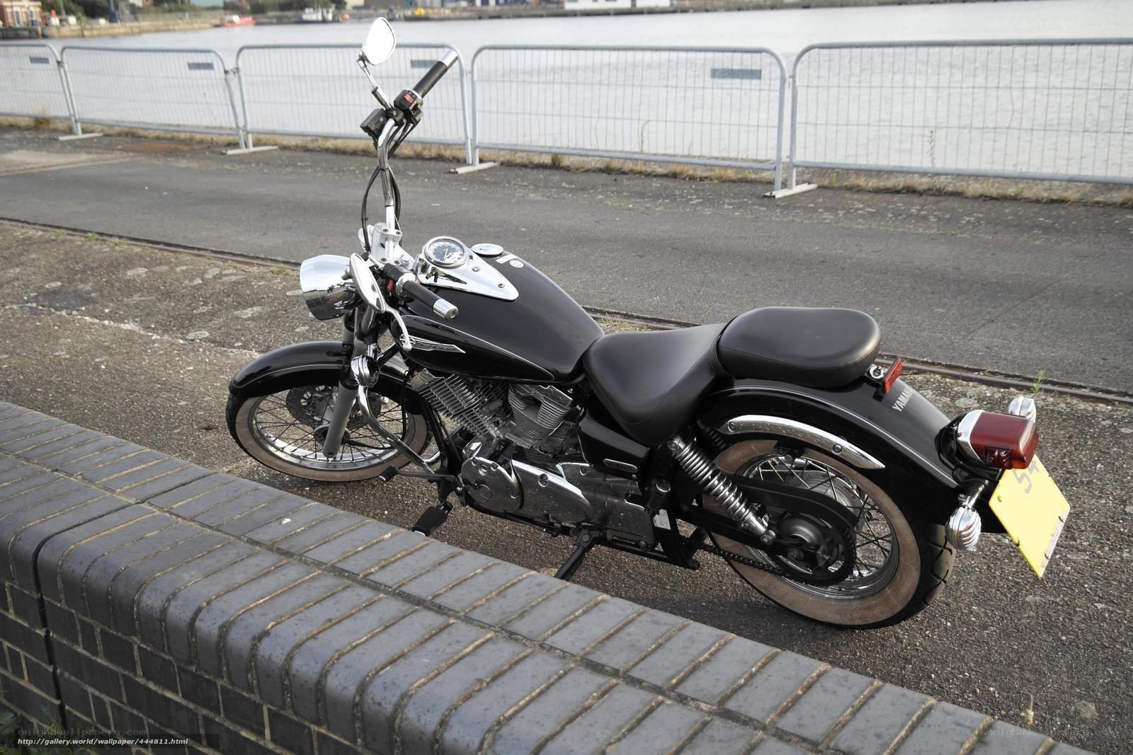 Black motorcycle by the water
