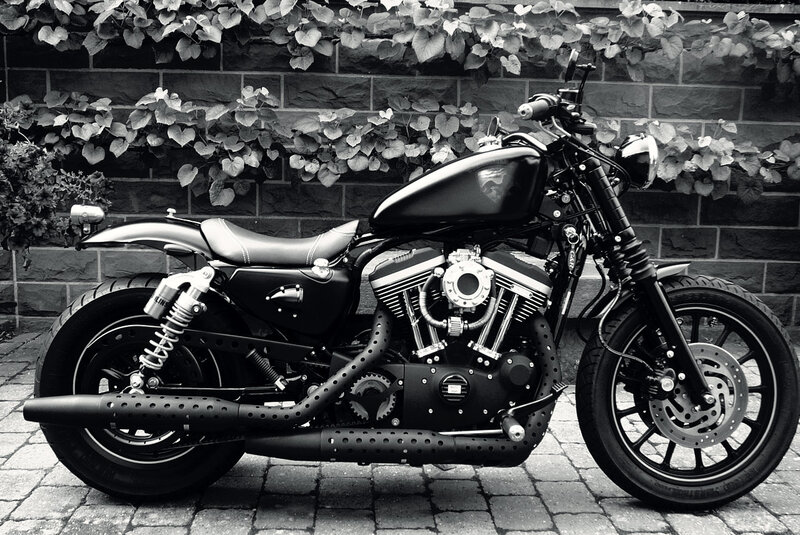 Black Motorcycle — Calm, Photograph, Brick Wall