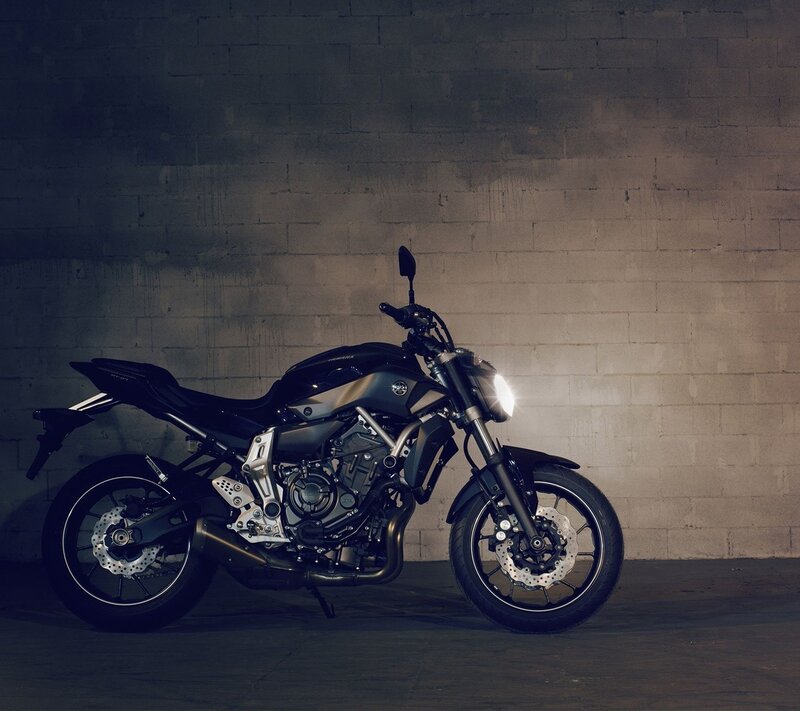 Black Motorcycle — Dramatic, Photograph, Brick Wall, Headlight