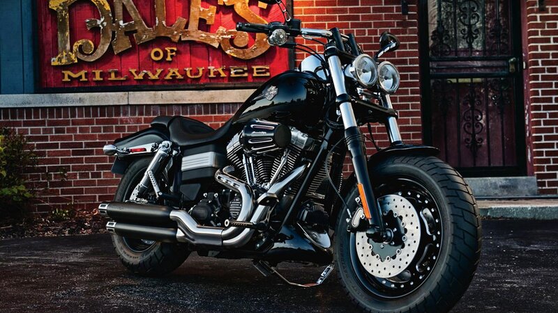 Black Motorcycle — Dramatic, Photograph, Brick Wall