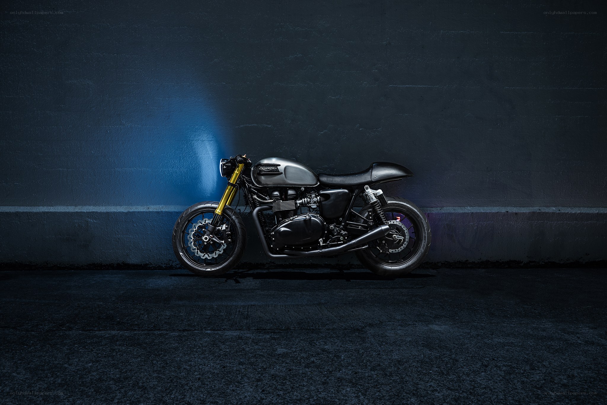 Black motorcycle in blue light