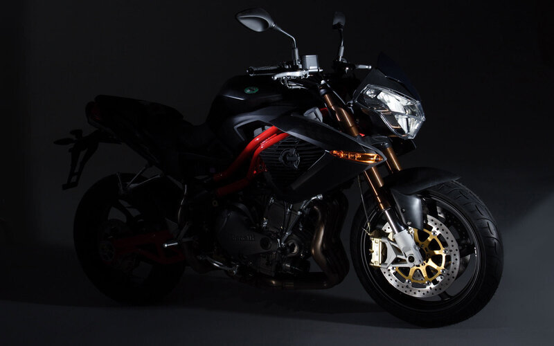black motorcycle in dark studio