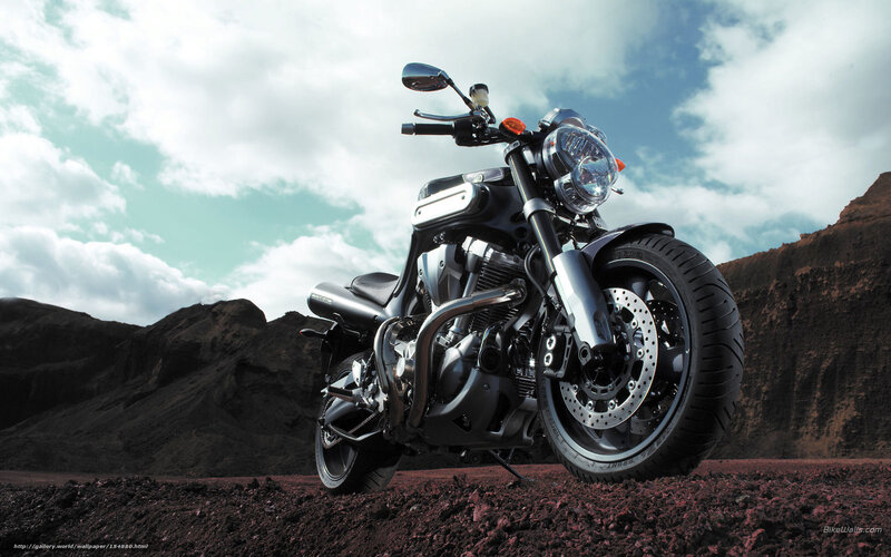 black motorcycle in desert landscape