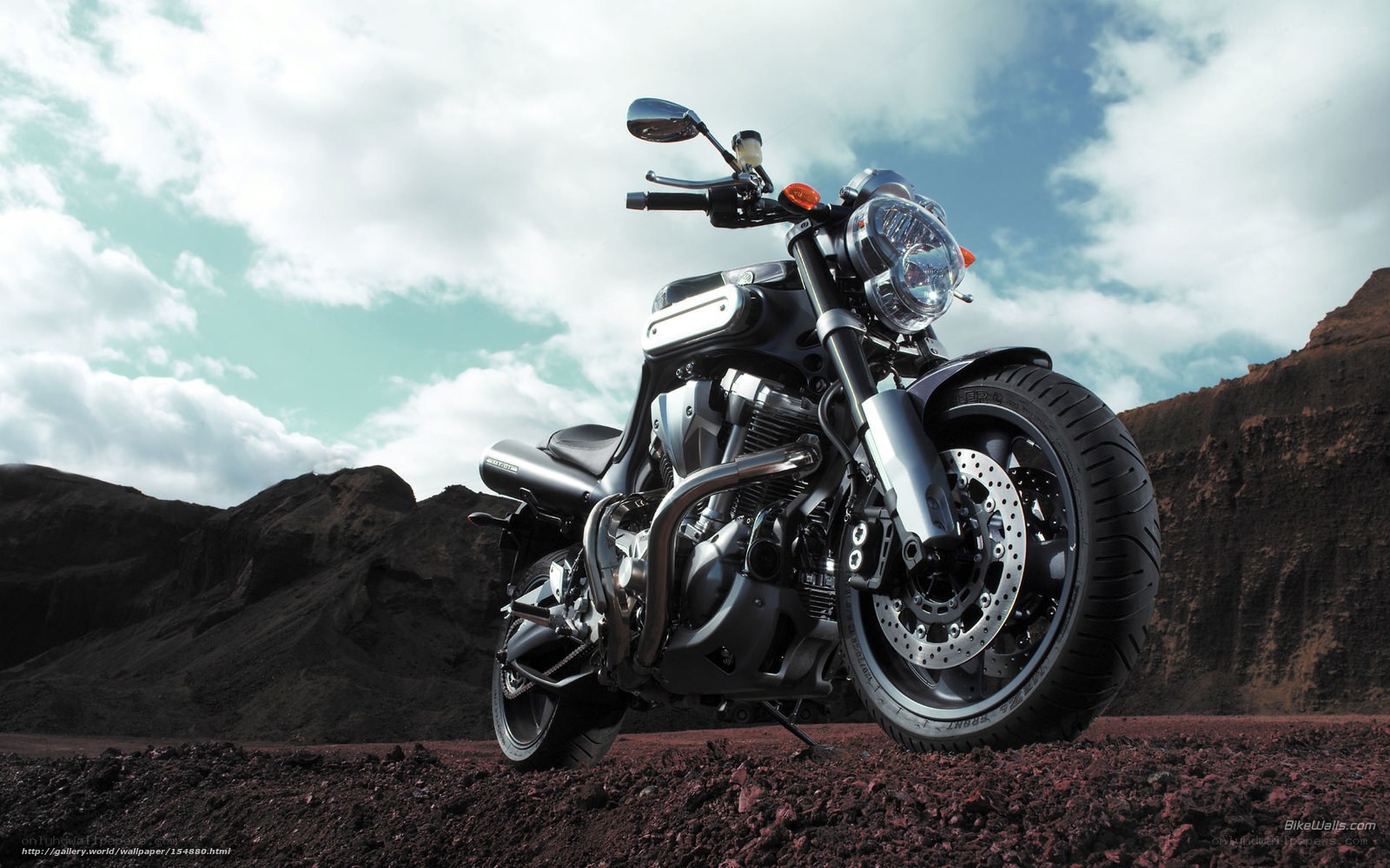 black motorcycle in desert landscape