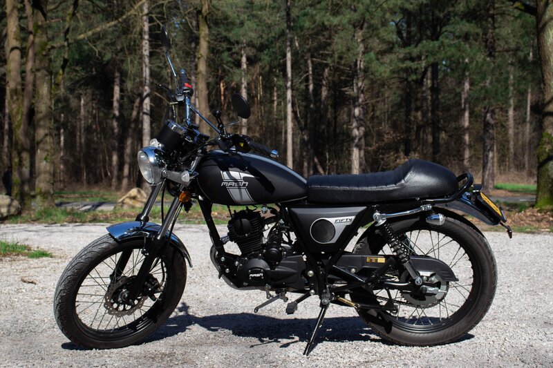 Black Motorcycle in Forest — Serene, Afternoon