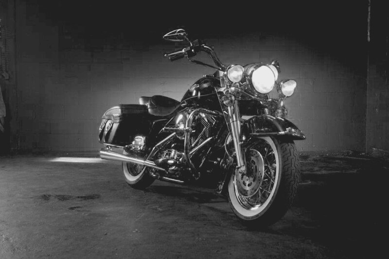 Black Motorcycle in Garage — Dramatic