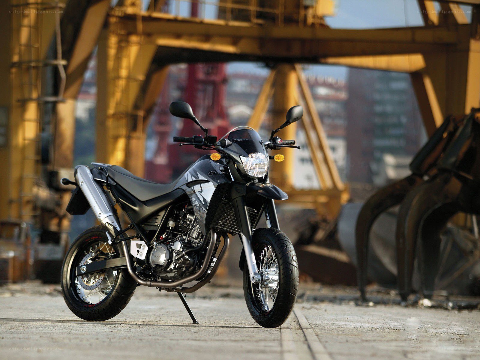 black motorcycle in industrial setting
