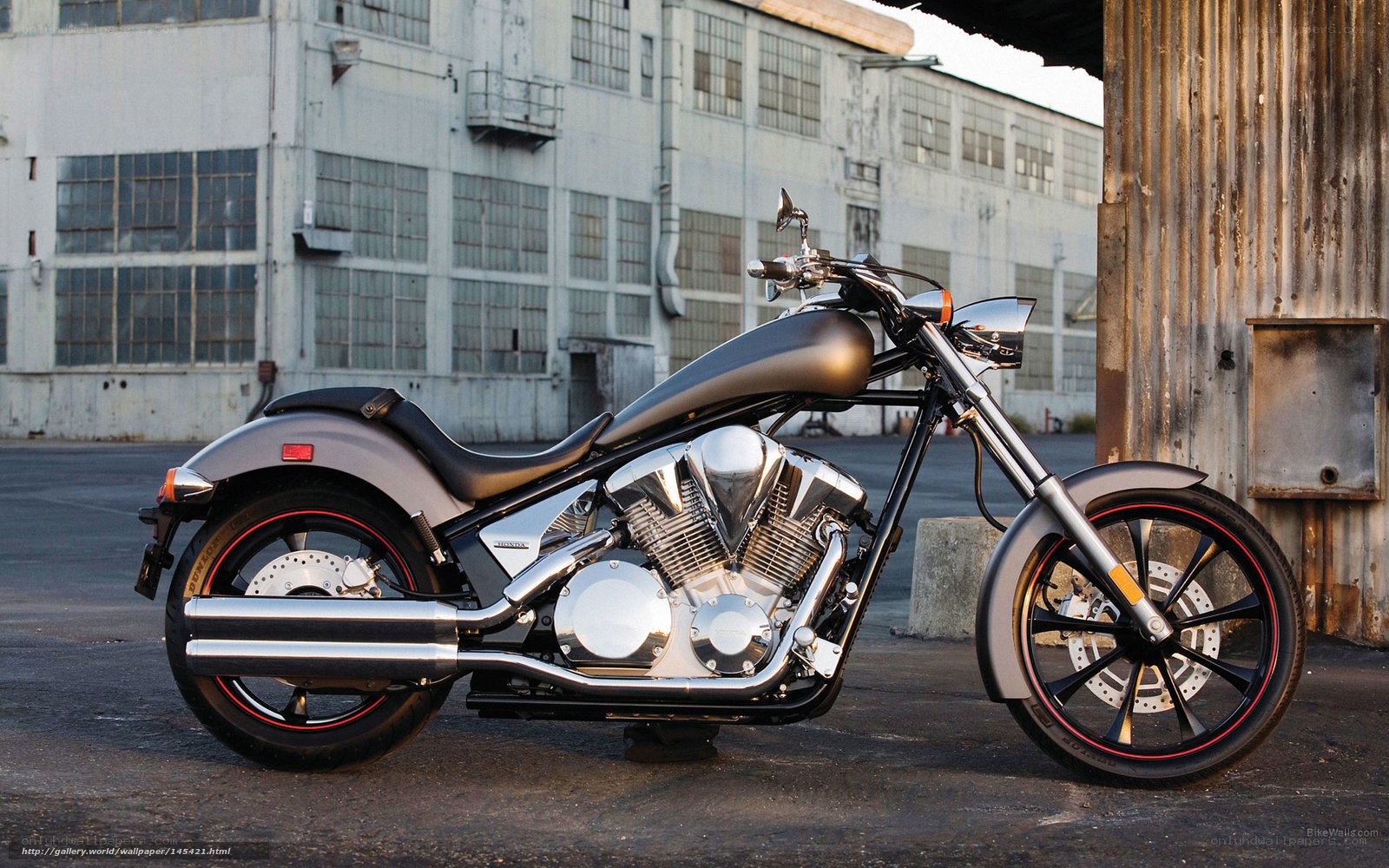 Black motorcycle in industrial setting
