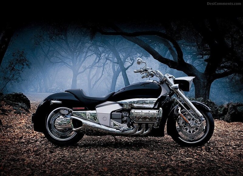 Black motorcycle in misty forest