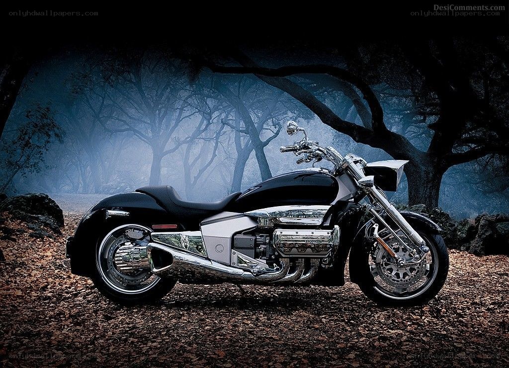 Black motorcycle in misty forest