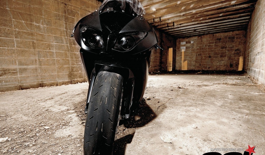 black motorcycle in underground tunnel