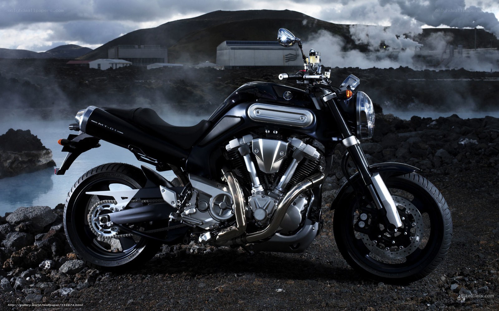 Black motorcycle in volcanic landscape