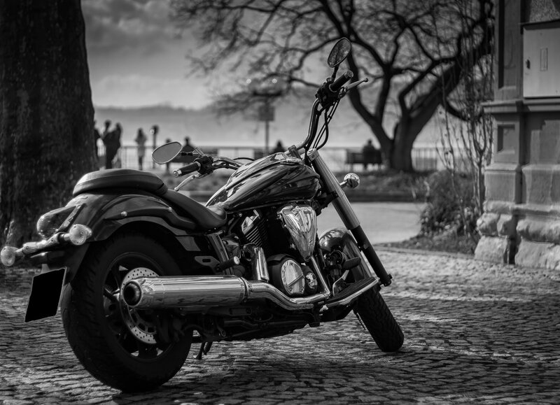 Black Motorcycle on Cobblestone