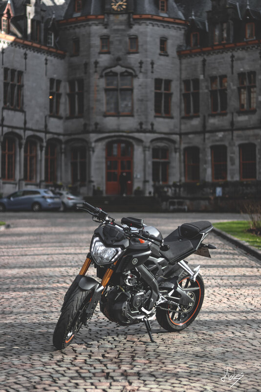 Black Motorcycle on Cobblestones
