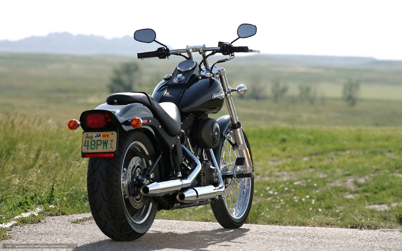 black motorcycle on country road