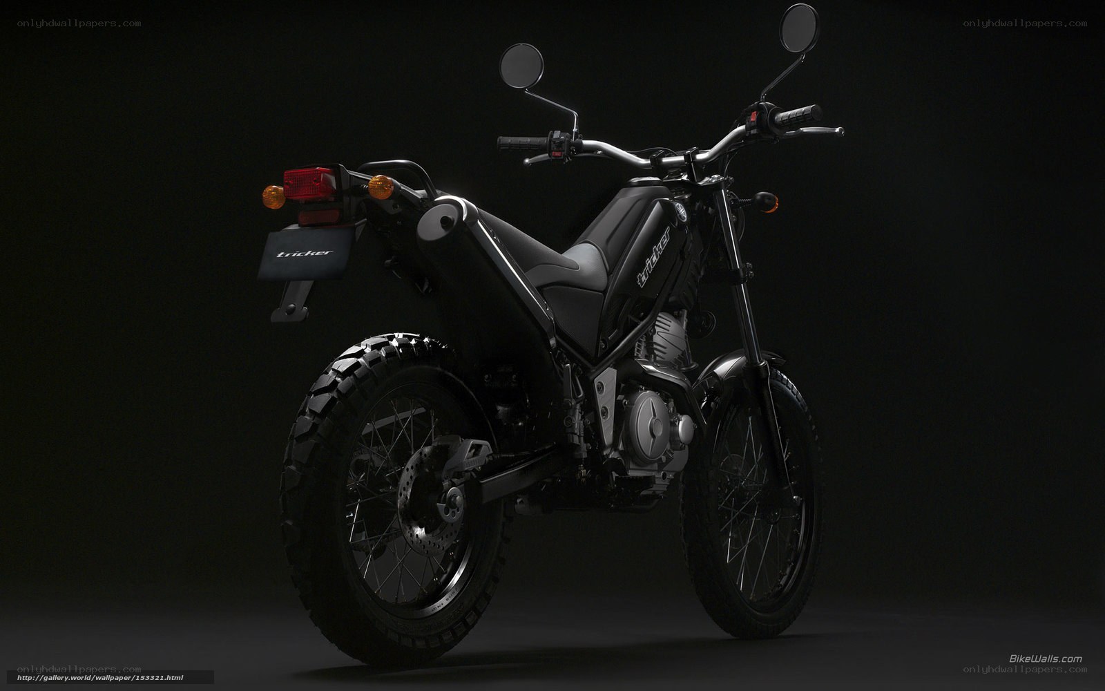black motorcycle on dark background