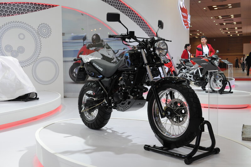 Black Motorcycle on Display — White
