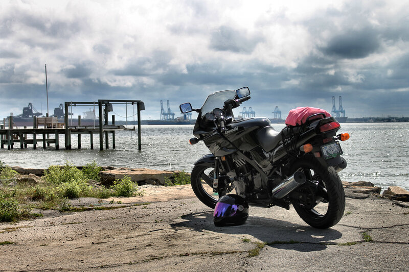 Black Motorcycle on Dock — Gray