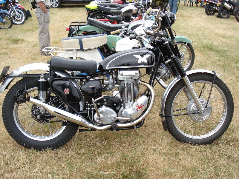Black Motorcycle on Grass — Calm, Afternoon