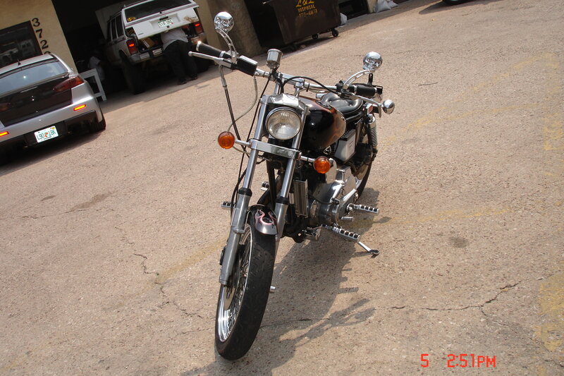Black Motorcycle on Pavement — Gray