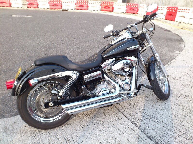 Black Motorcycle on Pavement — Neutral, Afternoon