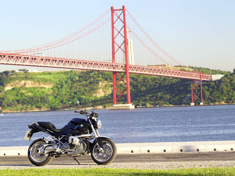 Black Motorcycle on Pavement — Red
