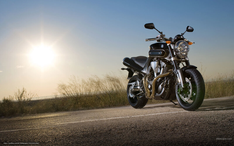 Black Motorcycle on Road — Dramatic, Sunset