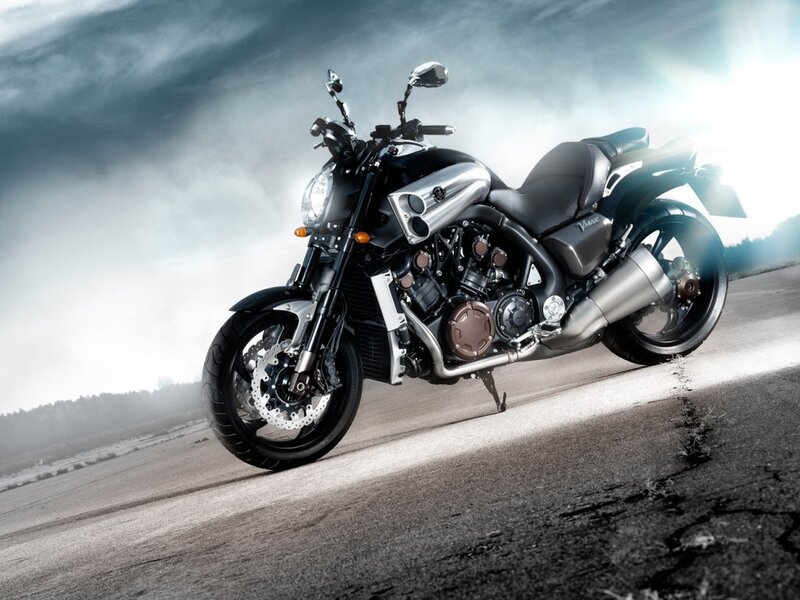 Black Motorcycle on Road — Dramatic