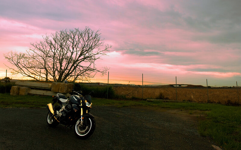 Black Motorcycle on Road — Pink