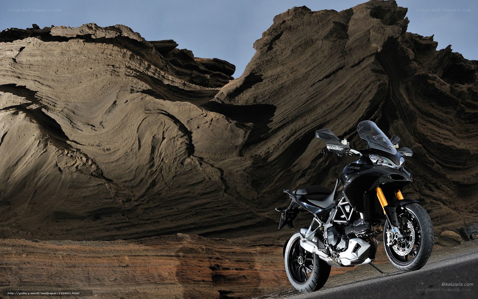 Black motorcycle on rocky terrain