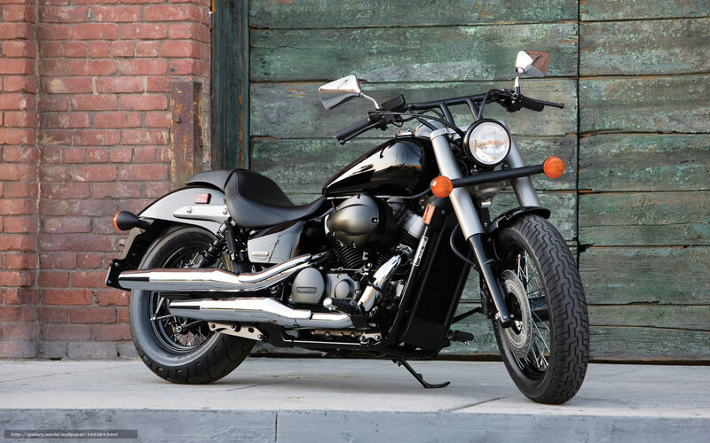 Black motorcycle on sidewalk