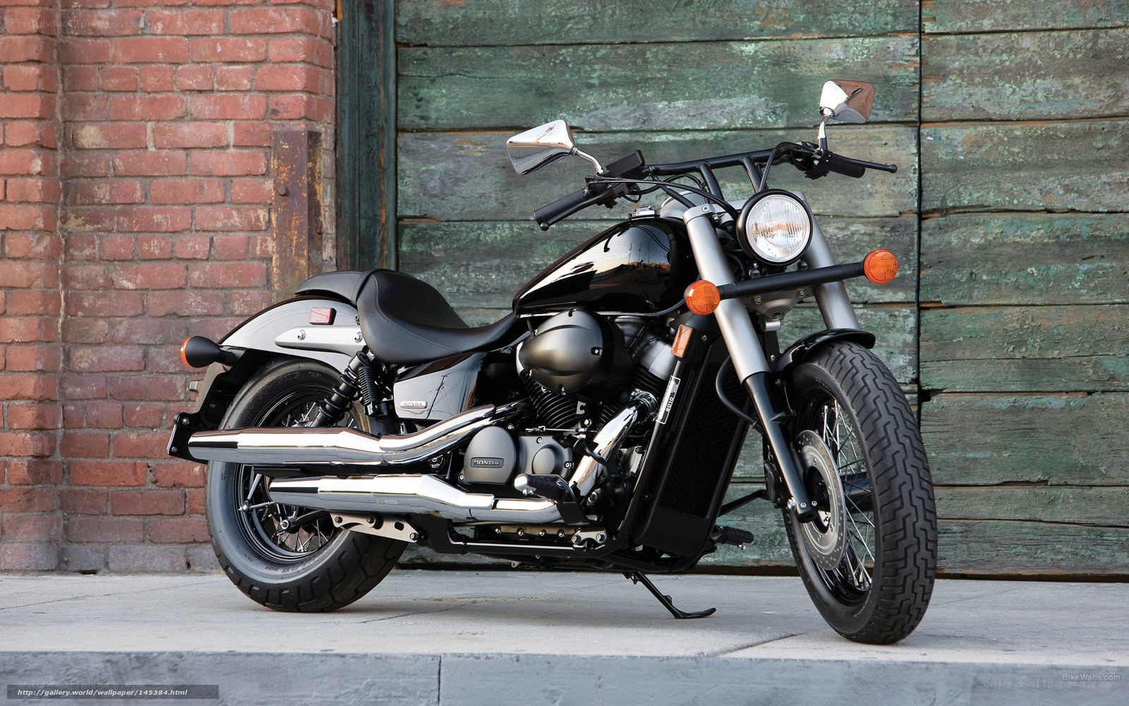 Black motorcycle on sidewalk