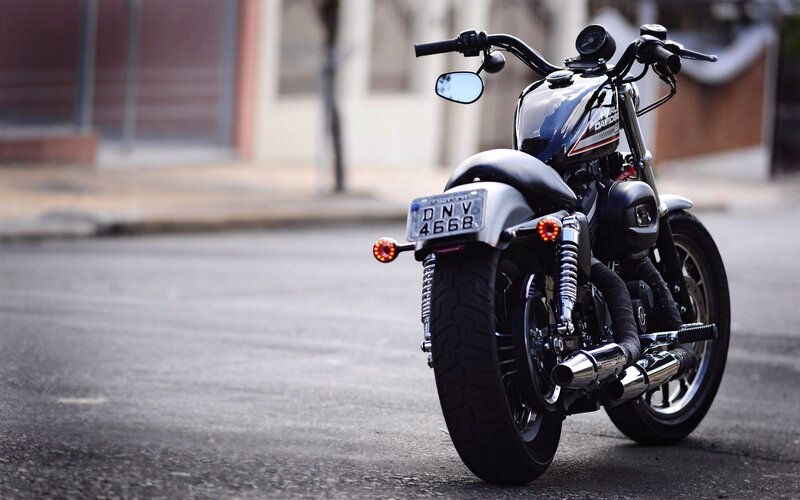 Black Motorcycle on Street — Calm, Afternoon, Photograph, Building