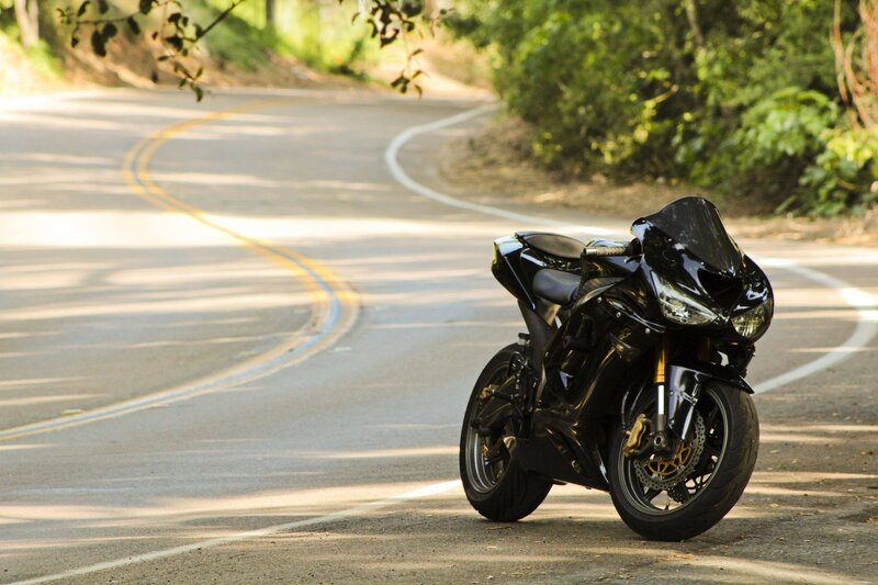 Black motorcycle on winding road
