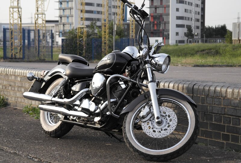 black motorcycle parked on street