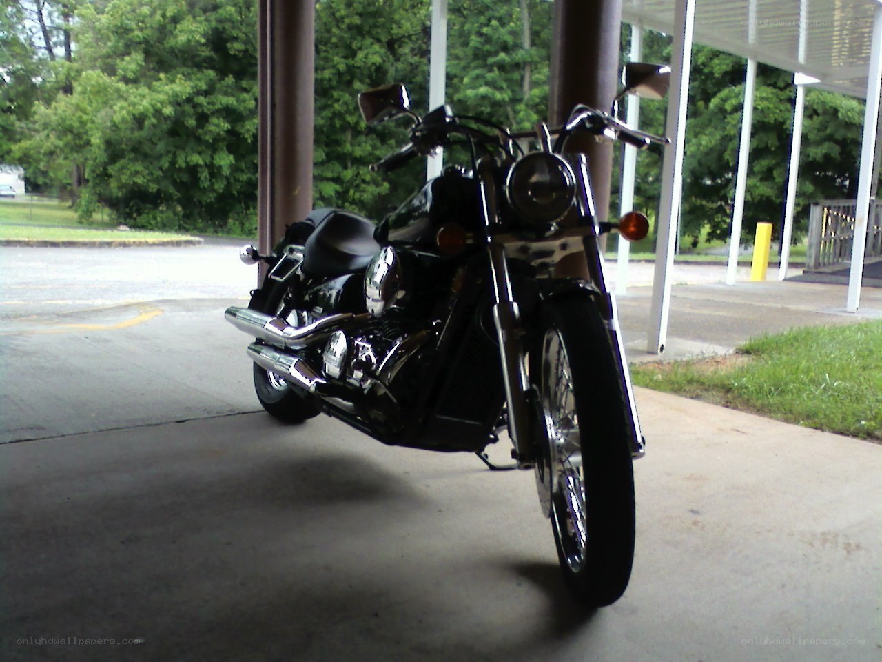 black motorcycle under shelter