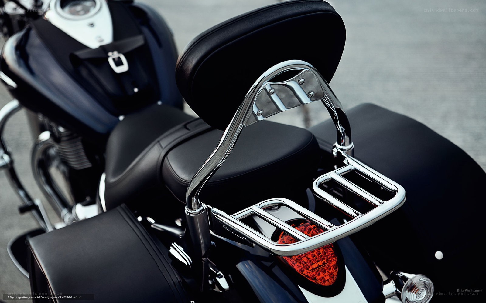 black motorcycle with chrome rack