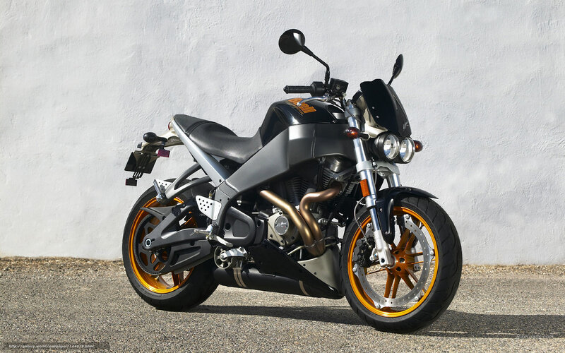 black motorcycle with orange wheels