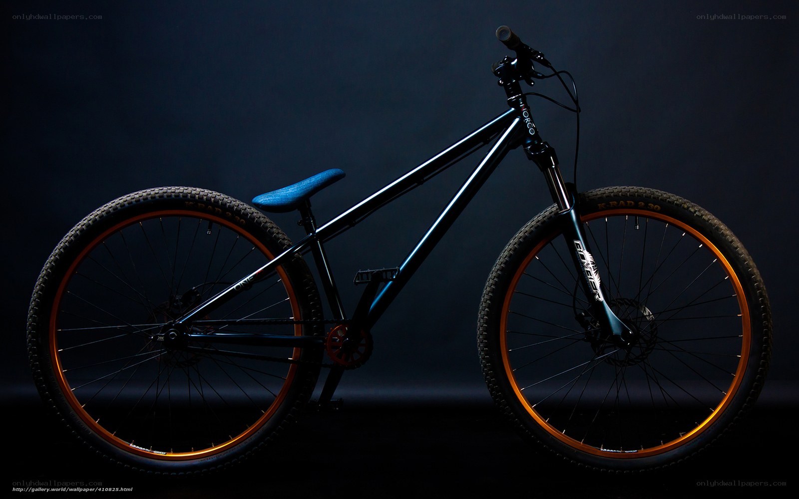 black mountain bike with blue seat