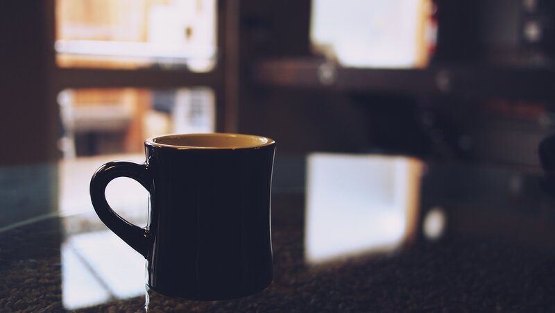 black mug on countertop