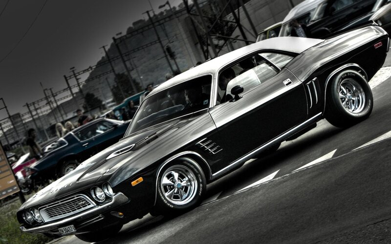 Black muscle car at a show
