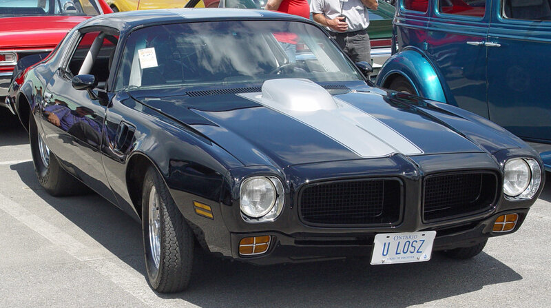 Black muscle car at a show