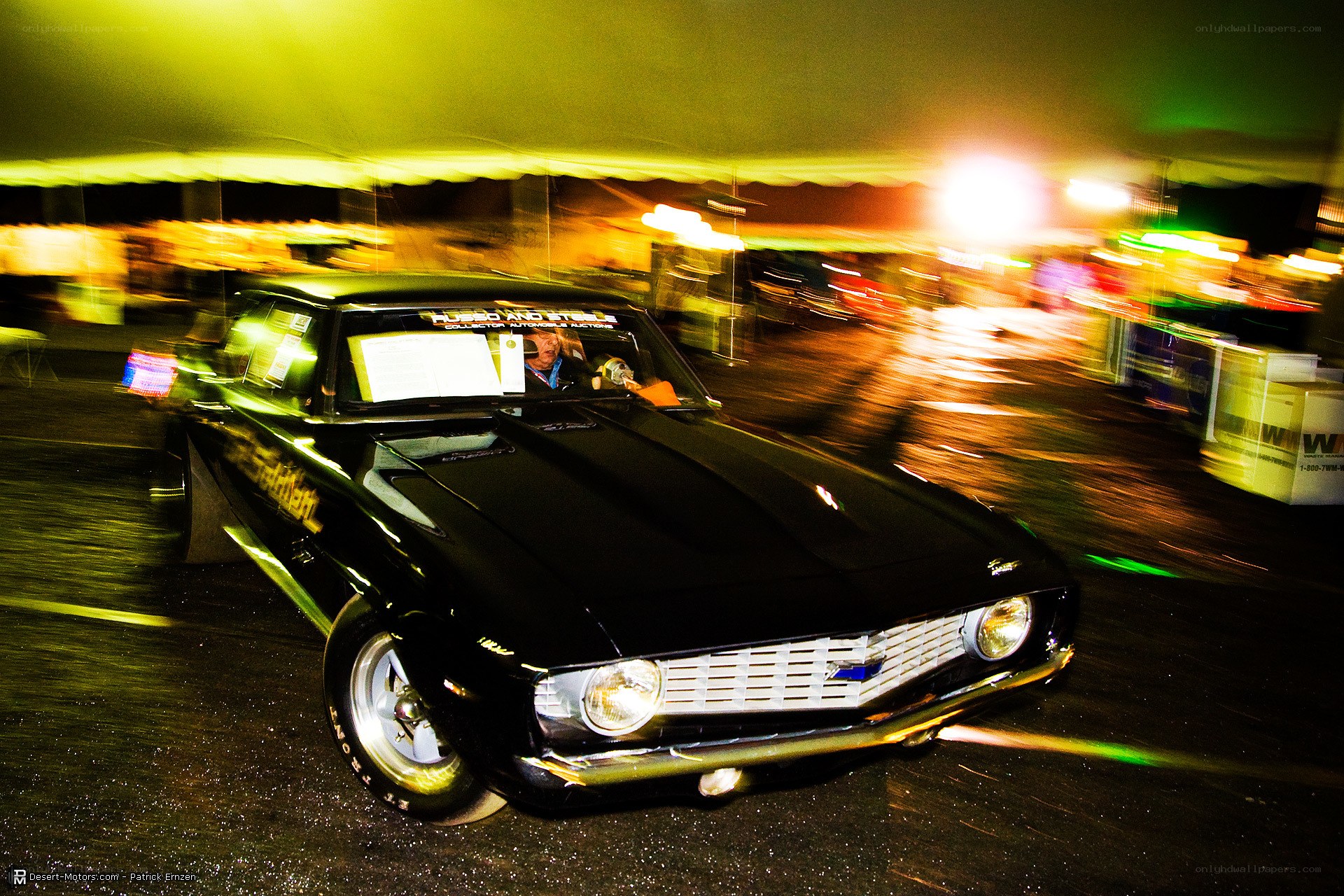 Black muscle car at night