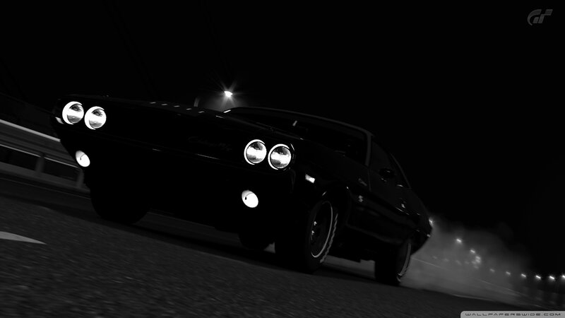 Black muscle car at night